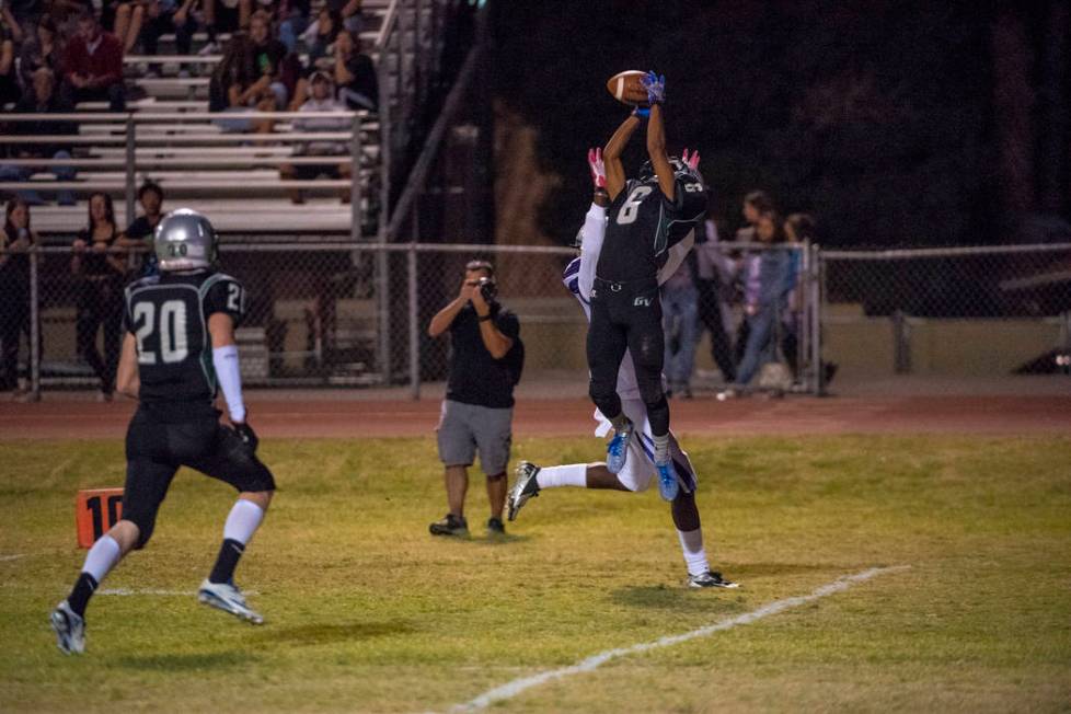 Green Valley defensive back Antoin Kealoha (6) intercepts the ball in front of Silverado rec ...