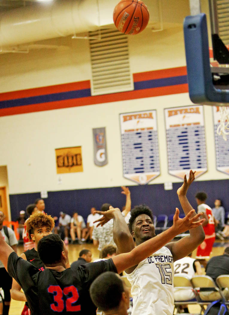 DC Premier’s Makhi Mitchell (15) attempts a basket against The Truth’s Carl Lewi ...