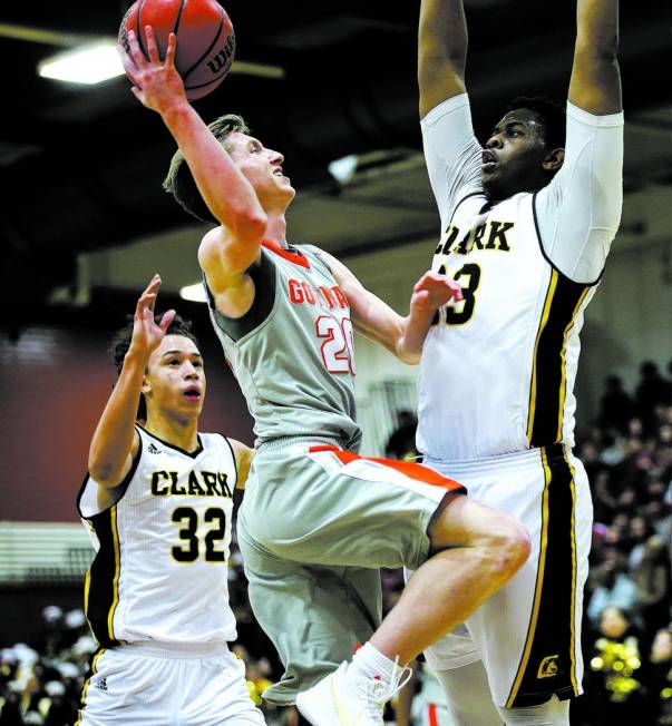 Bishop Gorman’s Noah Taitz (20) goes to the basket against Clark’s Antwon Jackso ...