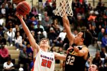 Bishop Gorman’s Noah Taitz (20) shoots against Clark’s Ian Alexander (32) during ...