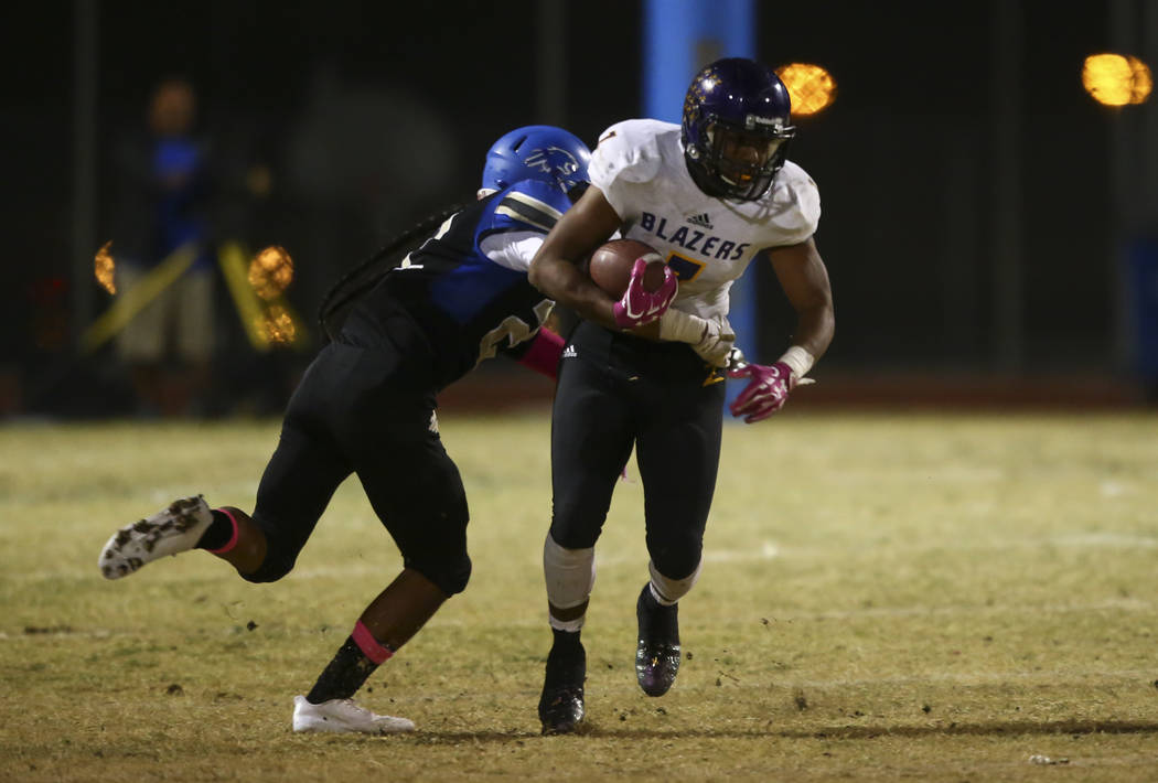 Sierra Vista’s Kyler Corpuz (22) tackles Durango’s T.K. Fotu (7) during a footba ...