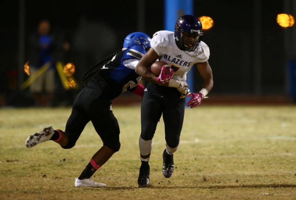 Sierra Vista’s Kyler Corpuz (22) tackles Durango’s T.K. Fotu (7) during a footba ...