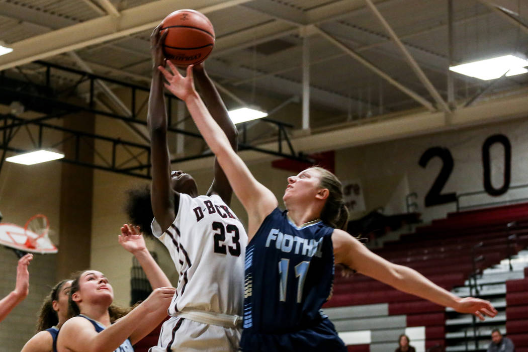 Desert Oasis’ Desi-rae Young (23), left, and Foothill’s Kaylee Hall (11), right, ...