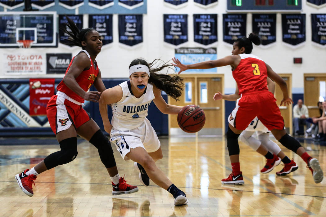 Centennial’s Melanie Isbell (2) dribbles the ball past Etiwanda’s Aujane Mayes ( ...