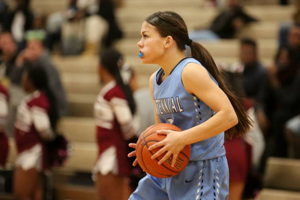 Centennial basketball player Melanie Isbell (2) handles the ball during a game against Cimar ...