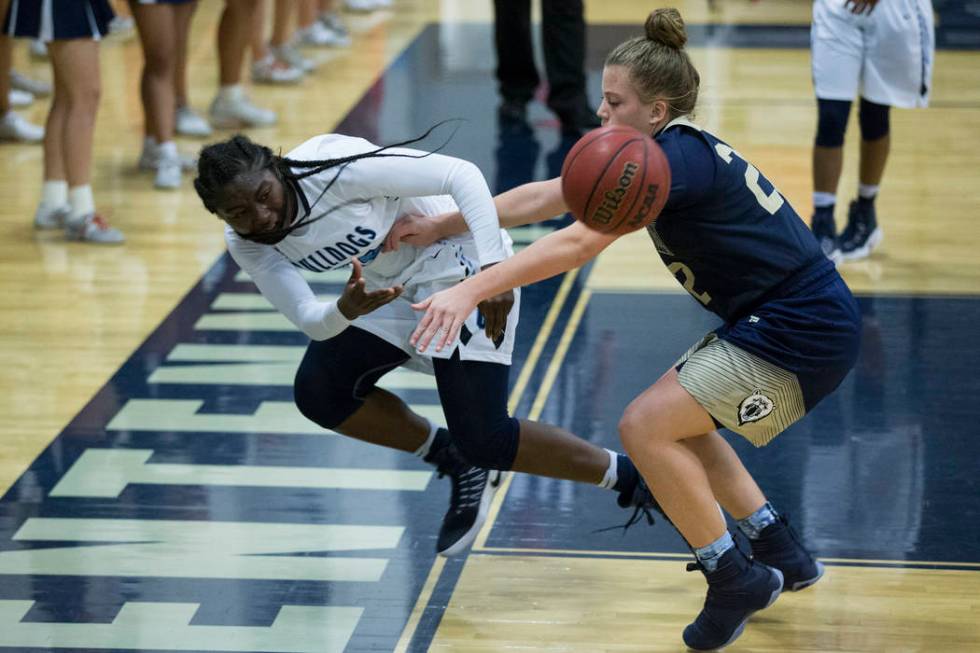 Centennial’s Eboni Walker (22) saves the ball against Spring Valley in the girls baske ...