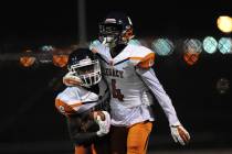 Legacy player Elisha Jackso (4) hugs running back Jeffrey Allen after Allen scored scored a ...