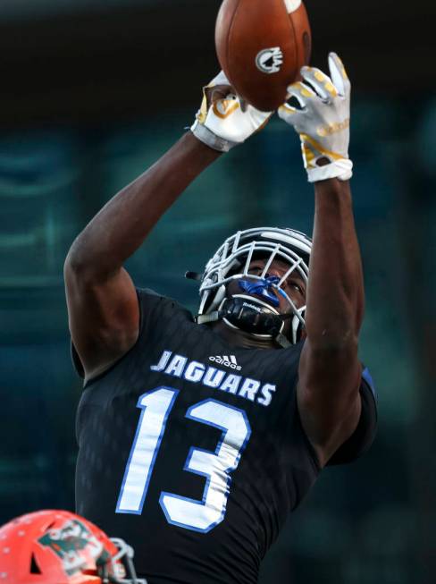 Desert Pines’ Darnell Washington (13) goes for the ball for against Mojave in the NIAA ...