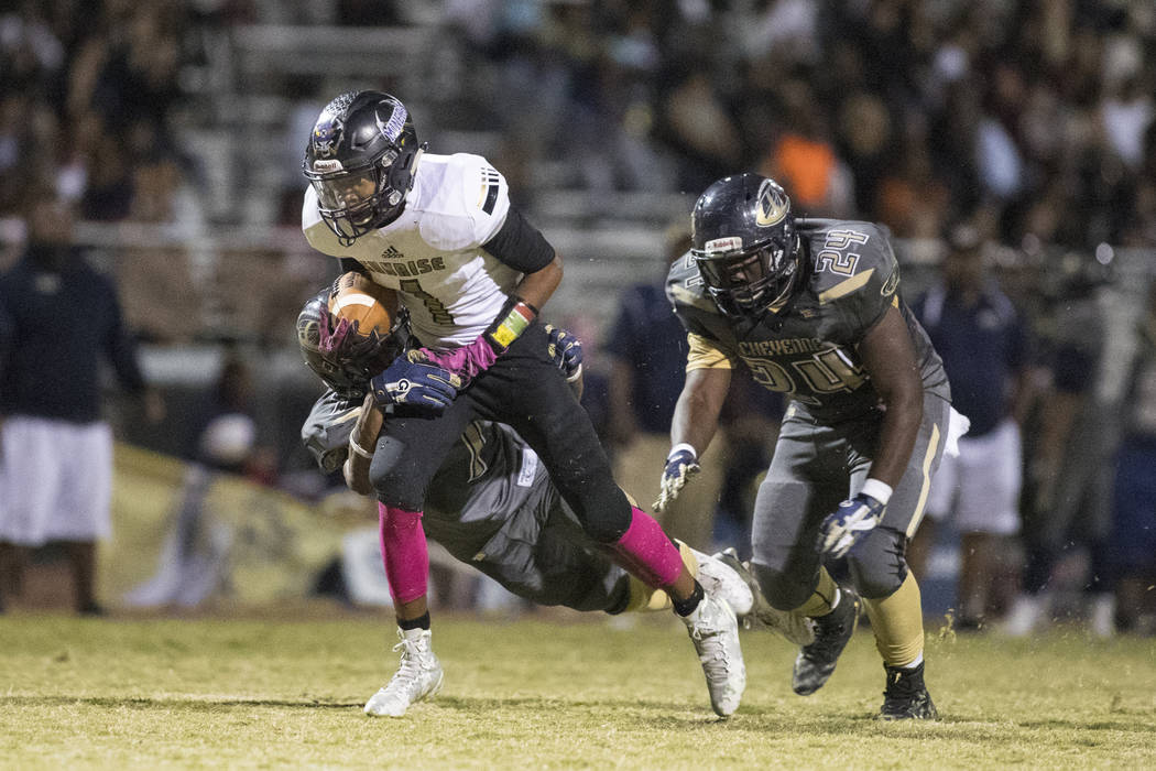 Sunrise Mountain High School’s Tyree Hayes runs the ball against Cheyenne High School ...