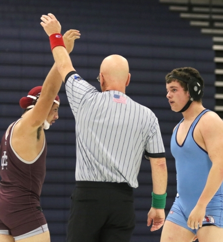 Cimarron-Memorial senior Nathaniel Garcia, left, is declared winner after wrestling Centenni ...