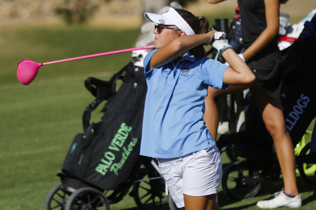 CentennialÕs McKenzi Hall watches her tee shot during the Class 4A state girls golf tou ...