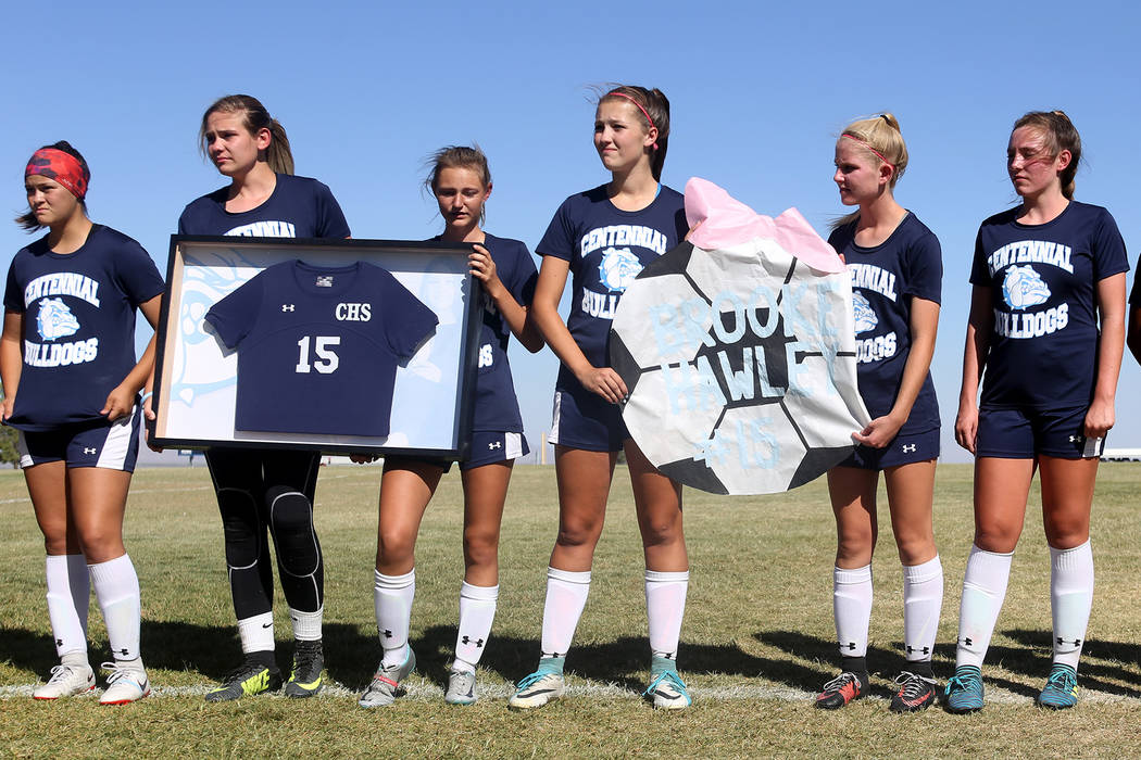 Members of Centennial High School’s women’s soccer team wear Brooke Hawley&#8217 ...