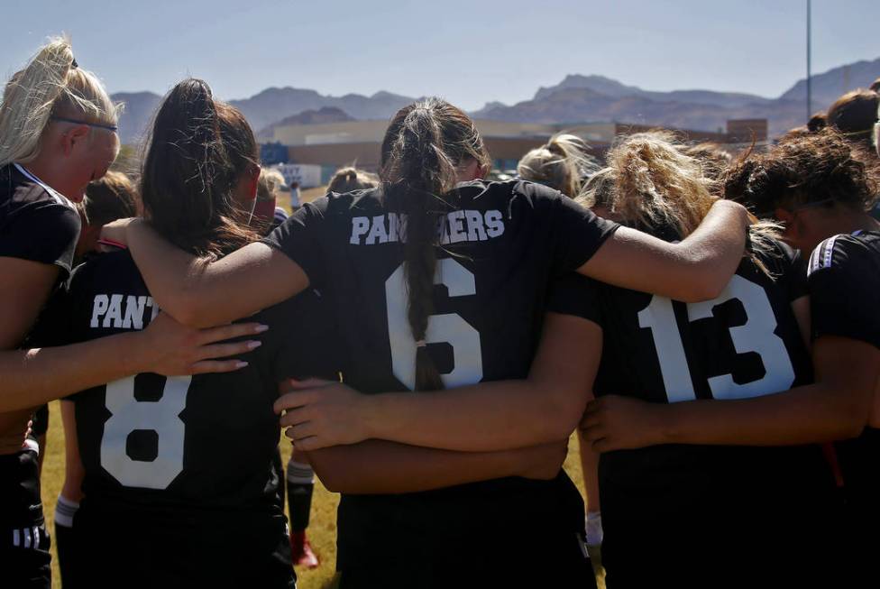 Palo Verde High School’s Holly Lindholm (6) huddles with her team before a game at Cen ...