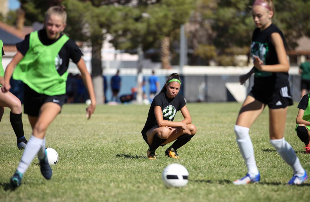 Green Valley’s Taylor O’Neill, 17, watches her teammates as they do a drill duri ...