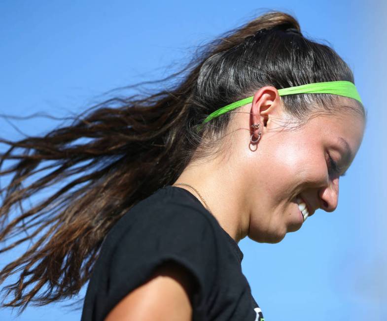 Green Valley’s Taylor O’Neill, 17, smiles as she looks down to grab a ball durin ...