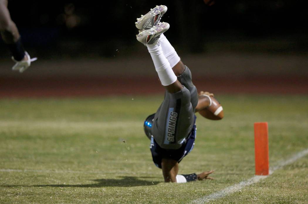 Canyon Springs’ Xavier Delong scores a touchdown against Green Valley High School in t ...