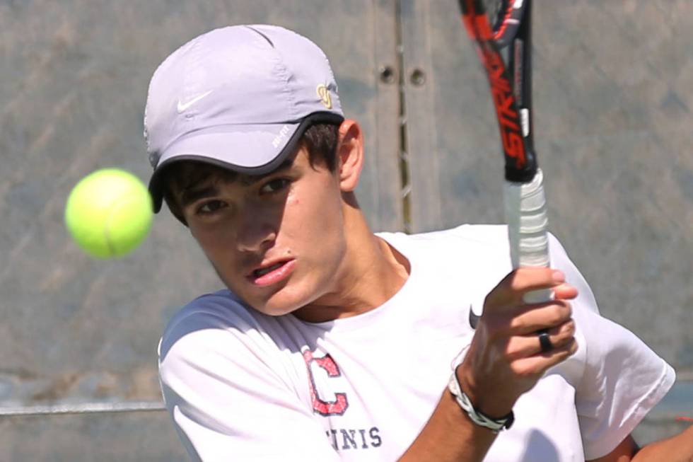 Coronado High singles player Sebastian Frace returns the ball against Clark’s High Max ...