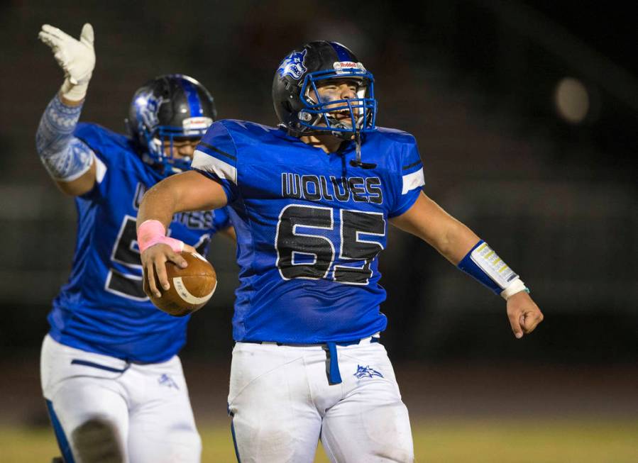 Basic defensive end Julio Duron (65) celebrates after recovering a fumble against Foothill d ...