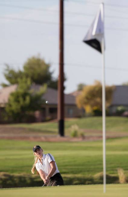 Faith Lutheran sophomore Gracie Olkowski chips onto the green at Stallion Mountain Golf Club ...