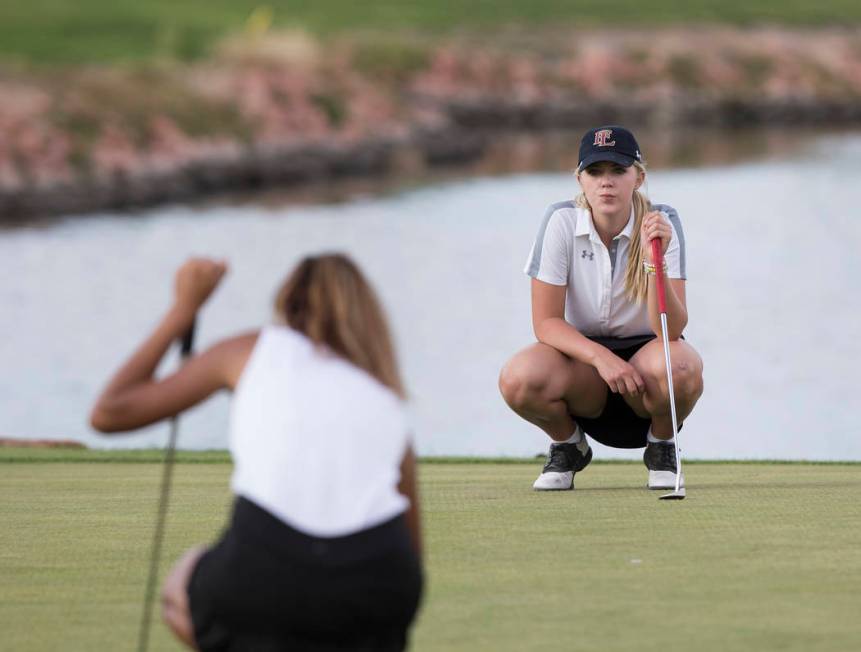 Faith Lutheran sophomore Gracie Olkowski, right, reads the green at Stallion Mountain Golf C ...