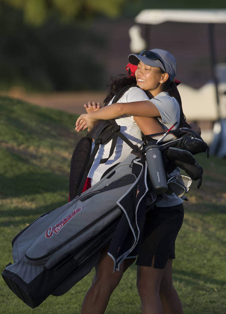 Clark sophomore Riana Mission, right, hugs Coronado’s Victoria Estrada after winning t ...