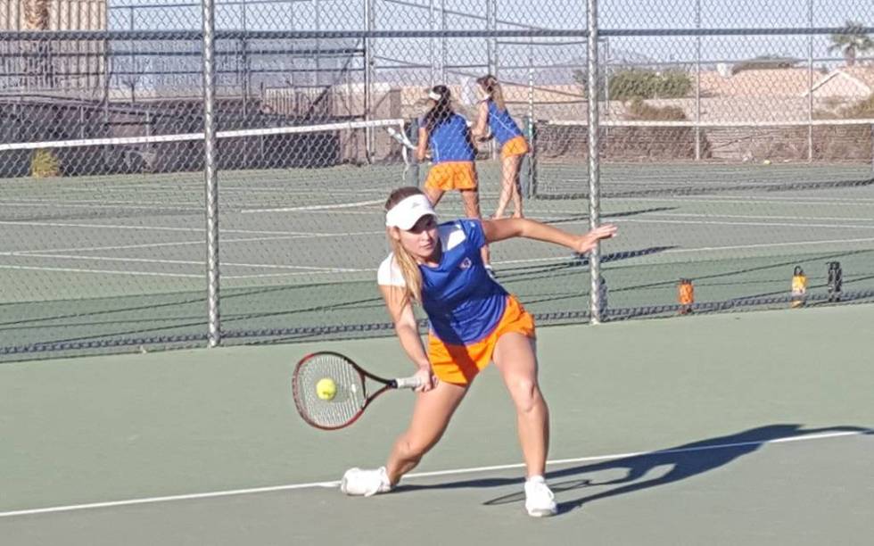 Bishop Gorman senior Angelique Friedrich returns a shot against Palo Verde senior Shelby Gra ...