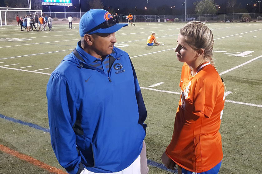 Bishop Gorman senior Gianna Gourley shares a moment with assistant coach Robert Andrade, aft ...