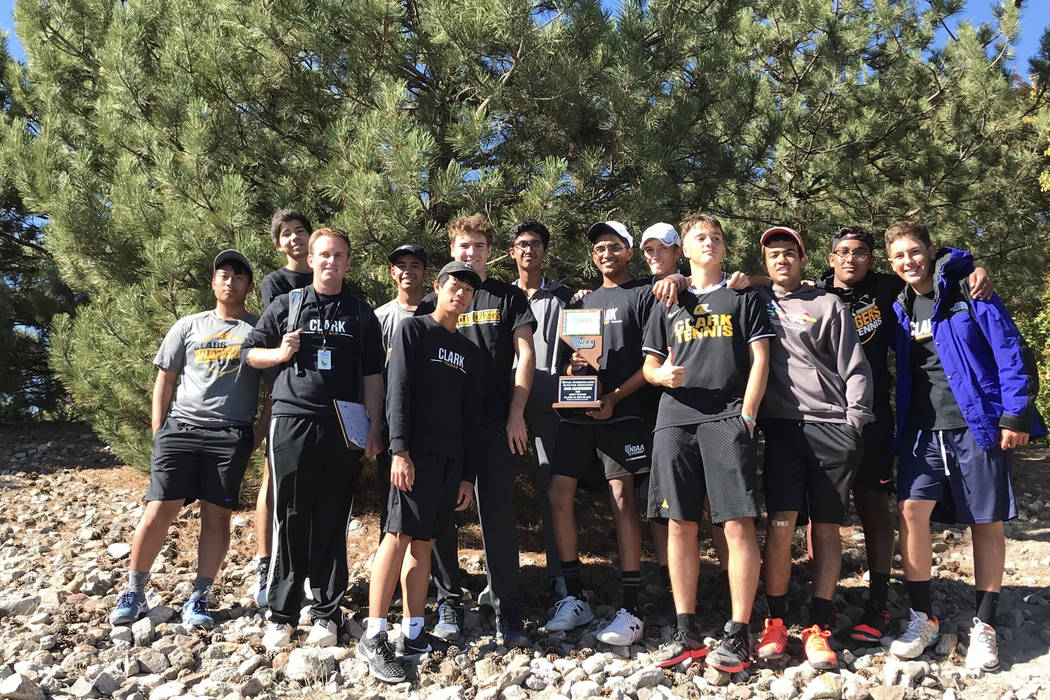 Clark boys tennis players pose with the Class 4A state runner-up trophy at Bishop Manogue Hi ...