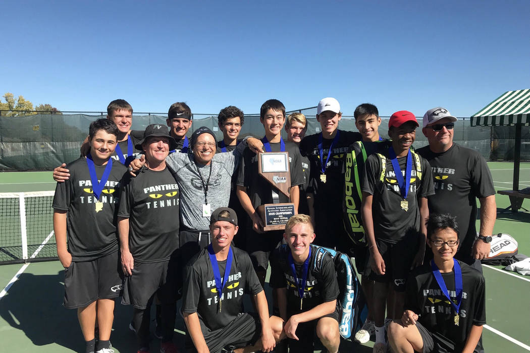 Palo Verde boys tennis players pose with the Class 4A state championship trophy at Bishop Ma ...