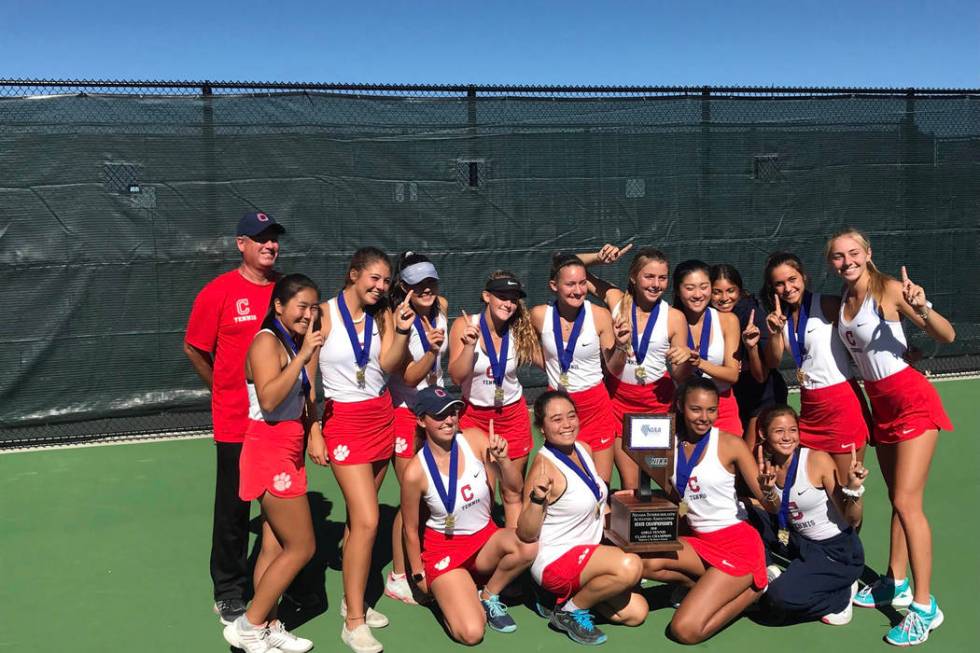 Coronado’s girls tennis team poses for a photo with the Class 4A state championship tr ...