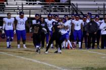 Durango’s Kaden Renshaw (5) delivers a hit on Durango’s Rome Odunze on Friday ni ...