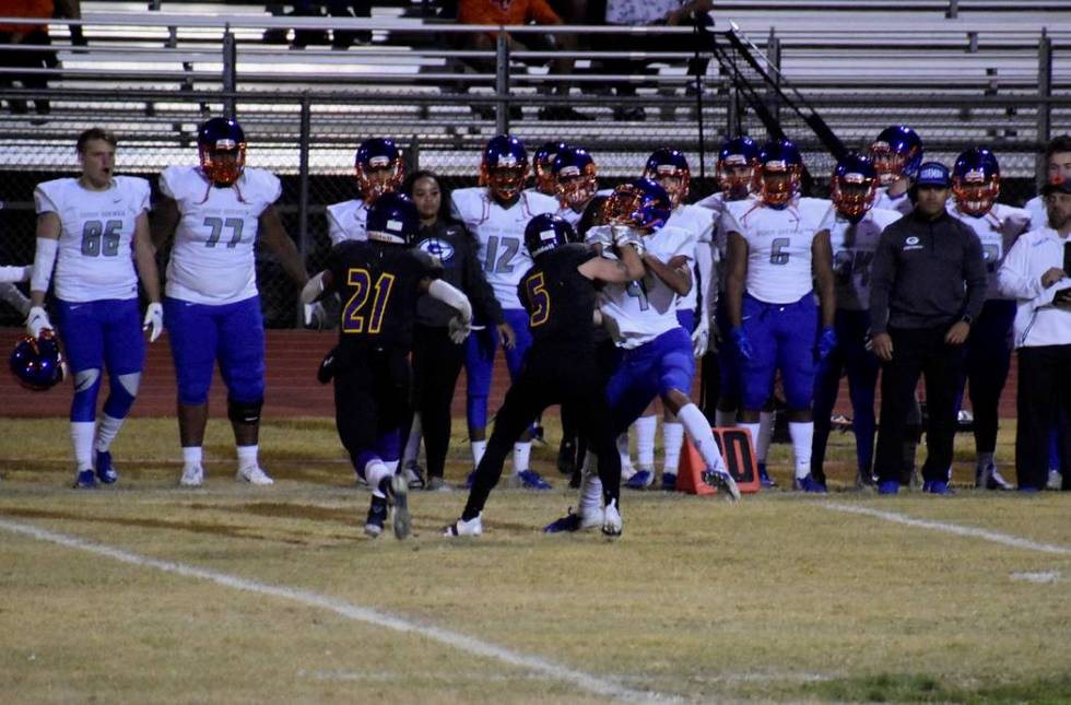 Durango’s Kaden Renshaw (5) delivers a hit on Durango’s Rome Odunze on Friday ni ...