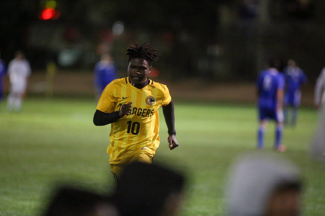 Clark High School’s Abraham Dolley (10) runs off the field after scoring a goal during ...