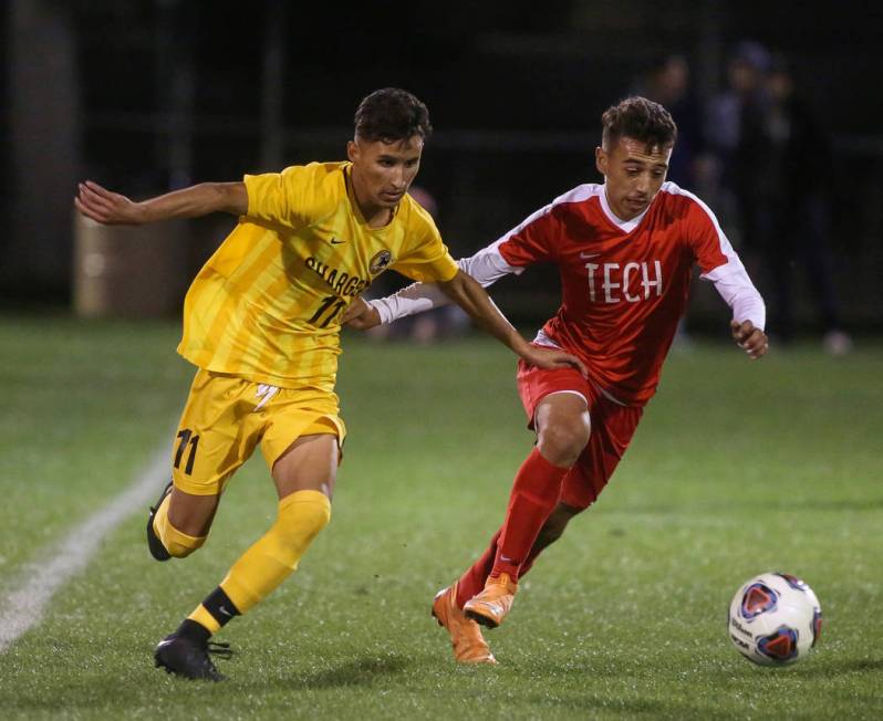 Clark High School’s Juan Beltran Diaz fights for the ball against Tech’s Jonatha ...