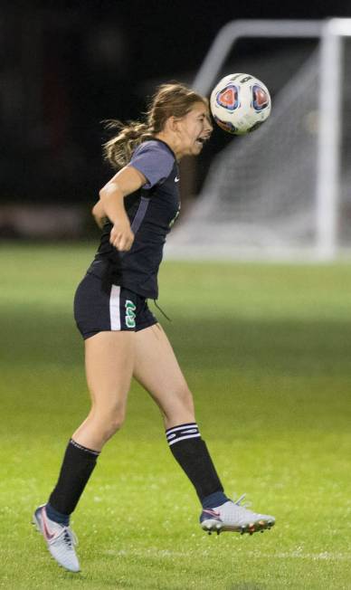 Green Valley junior midfielder Savannah Newman (5) heads a ball during the Gators game with ...