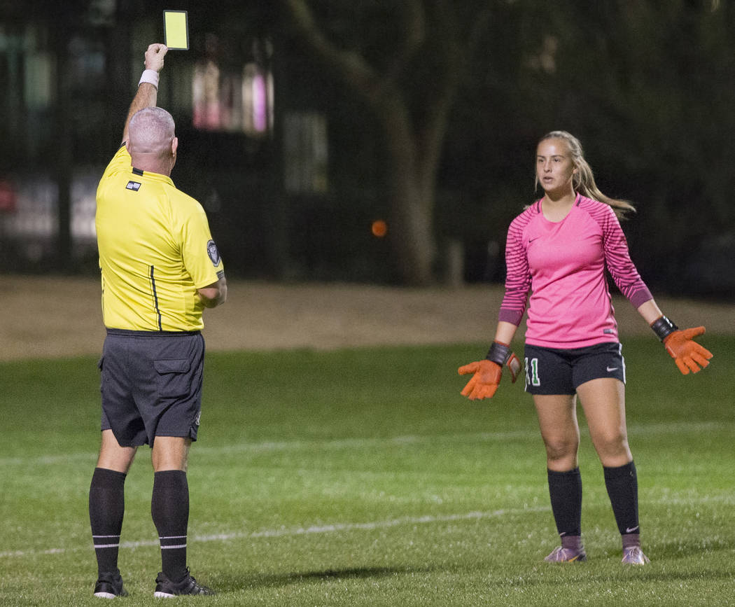 Green Valley junior goalkeeper Nicolette De La Carrera (11) reacts after receiving a yellow ...