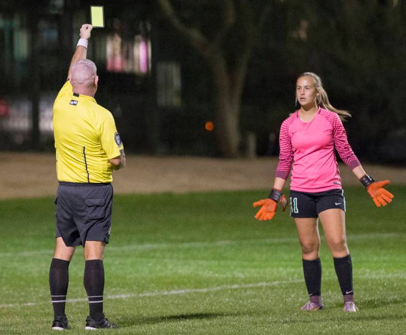 Green Valley junior goalkeeper Nicolette De La Carrera (11) reacts after receiving a yellow ...