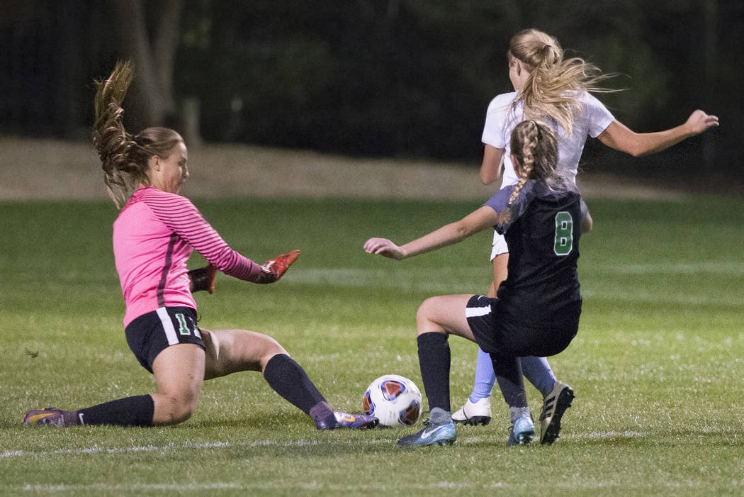 Green Valley junior goal keeper Nicolette De La Carrera (11) and teammate Ali Morton (8) def ...