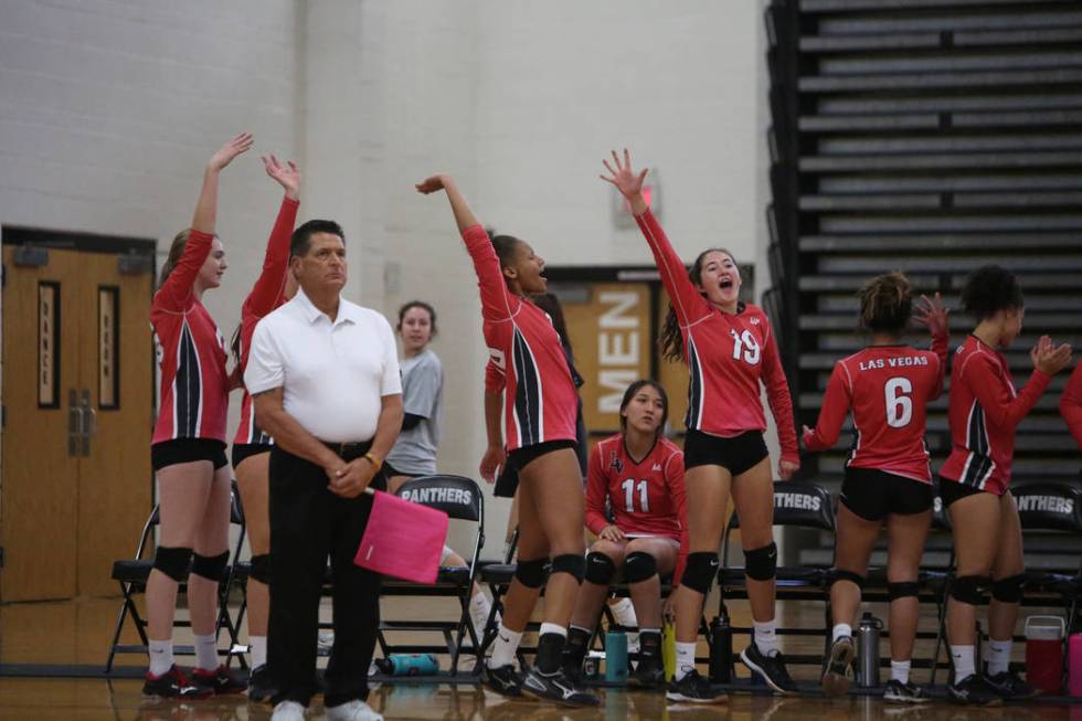 The Las Vegas High School Girls Varsity Volleyball team celebrates after winning a point aga ...