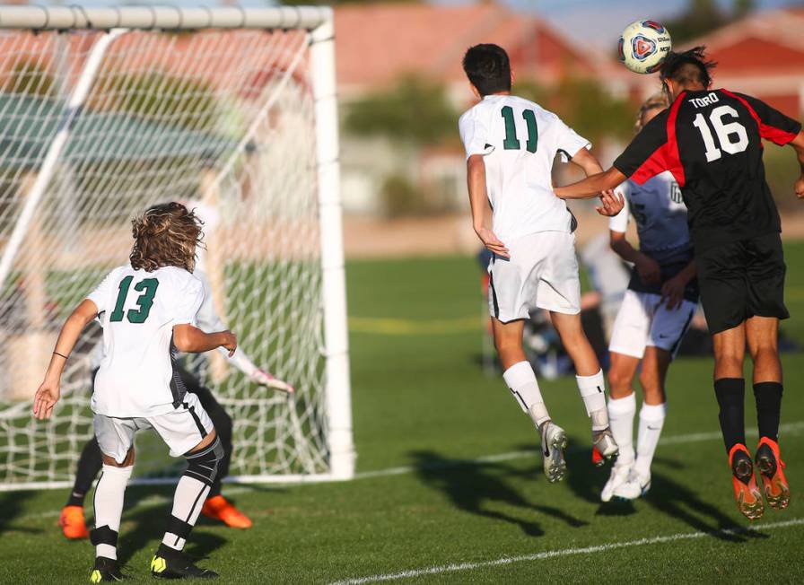 Las Vegas’ Nathan Zamora (16) heads the ball past Palo Verde defenders to score a goal ...