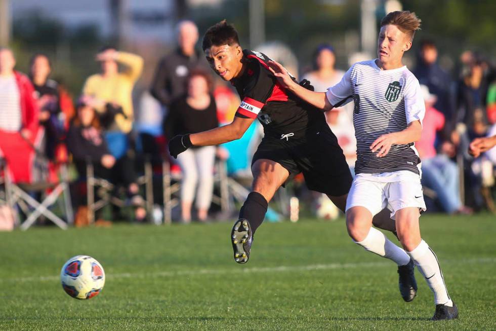 Las Vegas’ Daniel Rangel (8) kicks the ball past Palo Verde’s Luke McGee to scor ...