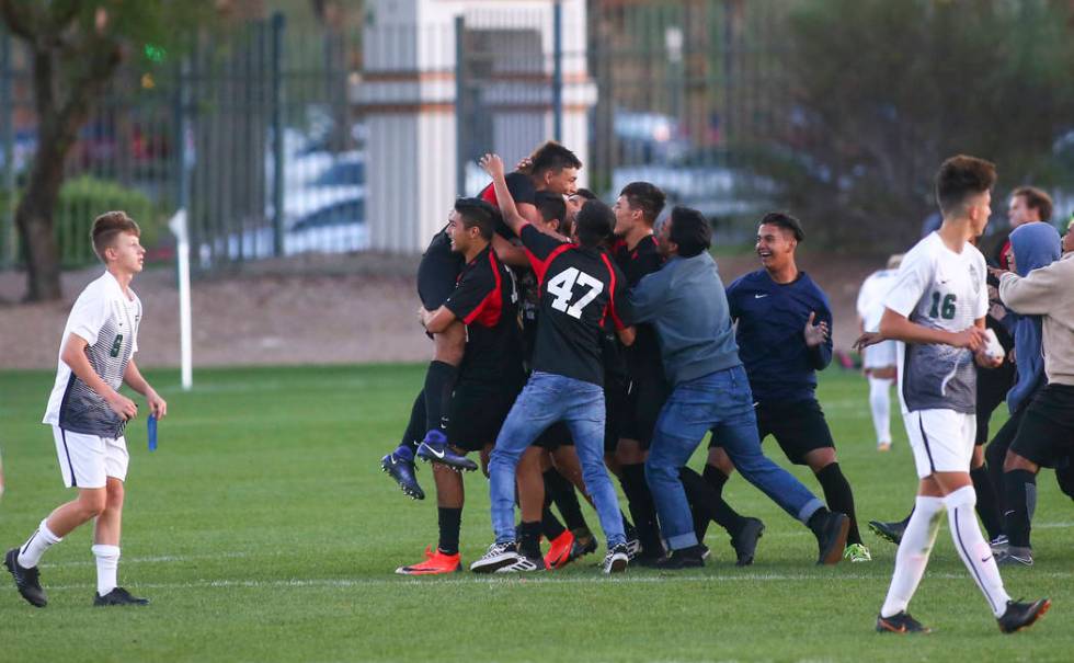 Las Vegas players celebrate their win over Palo Verde in the Mountain Region boys soccer sem ...