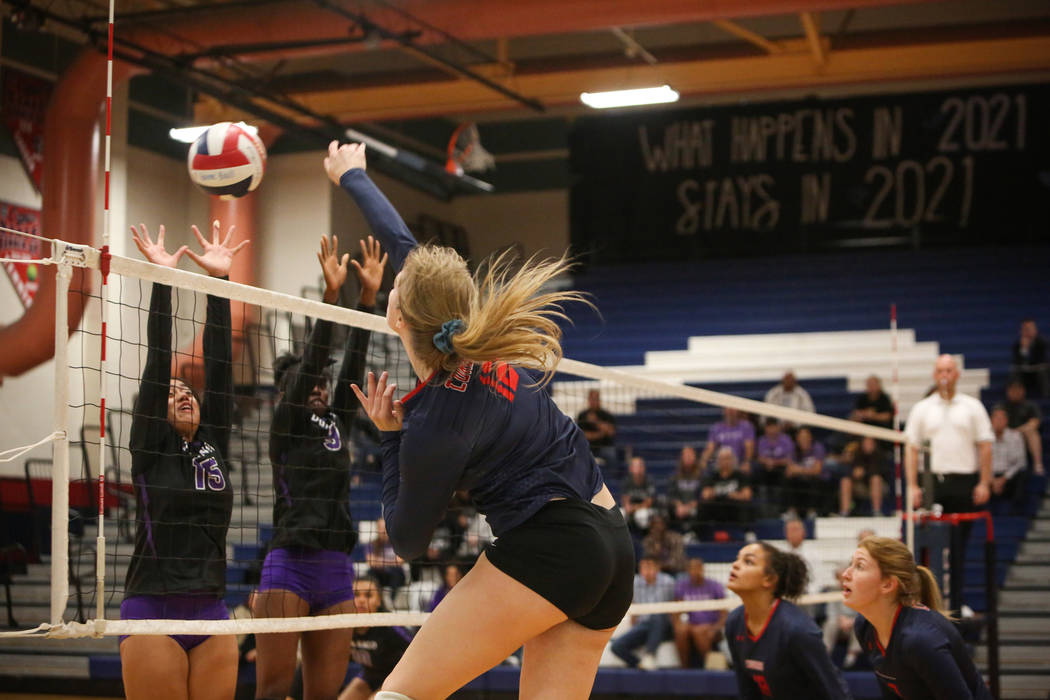 Coronado’s Sasha Bolla hits the ball over the net as Durango’s Anuhea Faitau, le ...