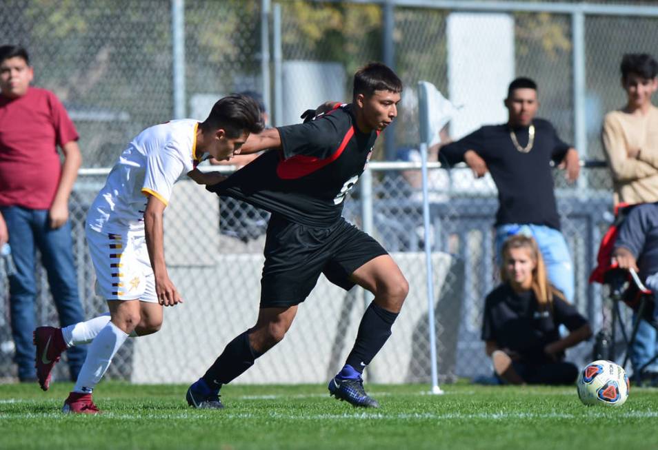 Eldorado’ High School’s Jesus Espejo (6) tugs on the jersey of Las Vegas High Sc ...