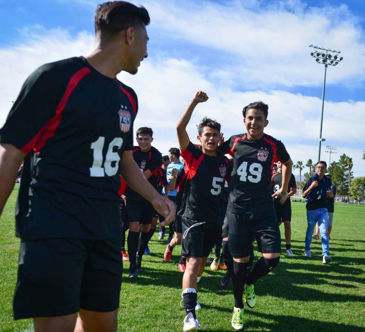 The Las Vegas High School soccer team celebrates winning the the 3A Mountain Region Champion ...