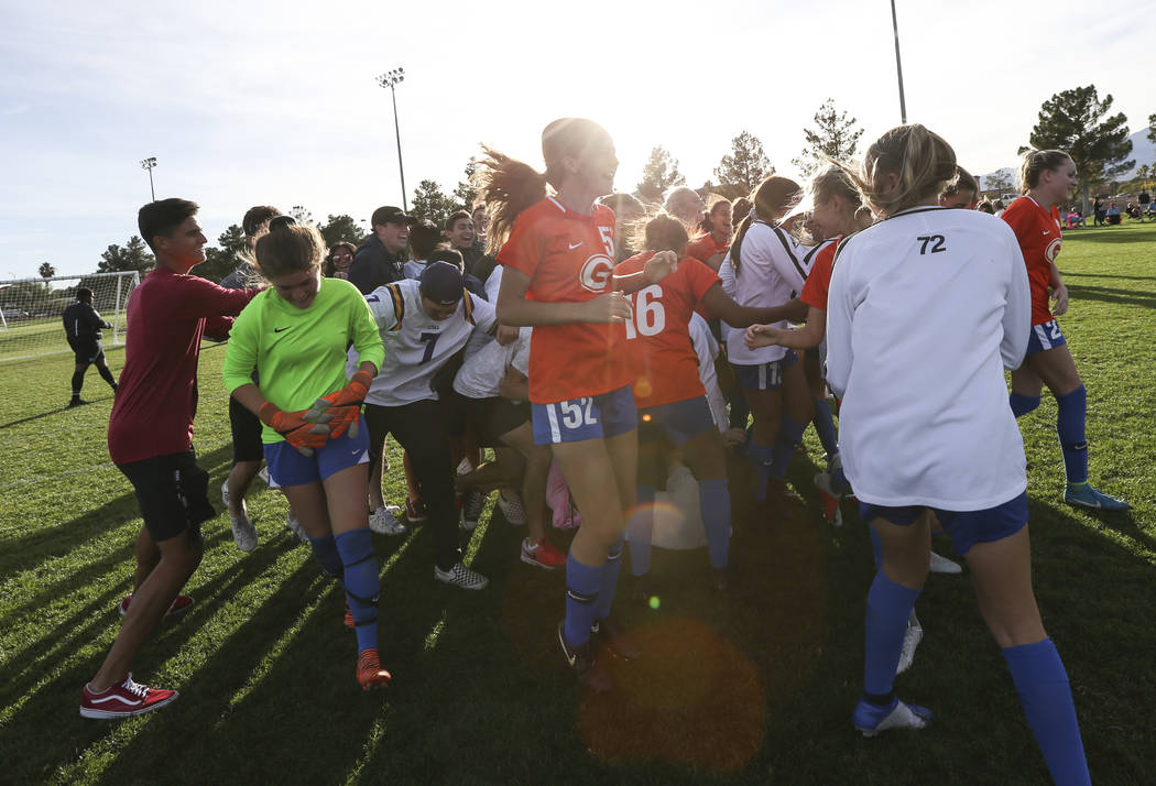 Bishop Gorman players celebrate their win over Coronado in the Desert Region girls soccer ch ...