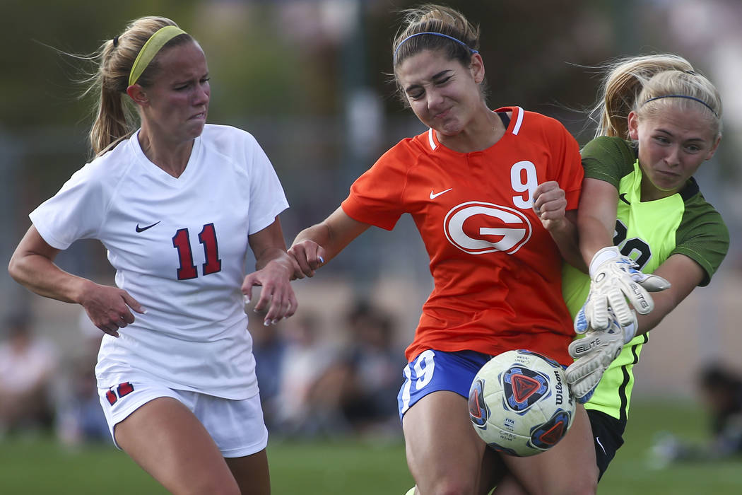 Bishop Gorman’s Jaden Terrana (9) fights to maintain control of the ball against Coron ...