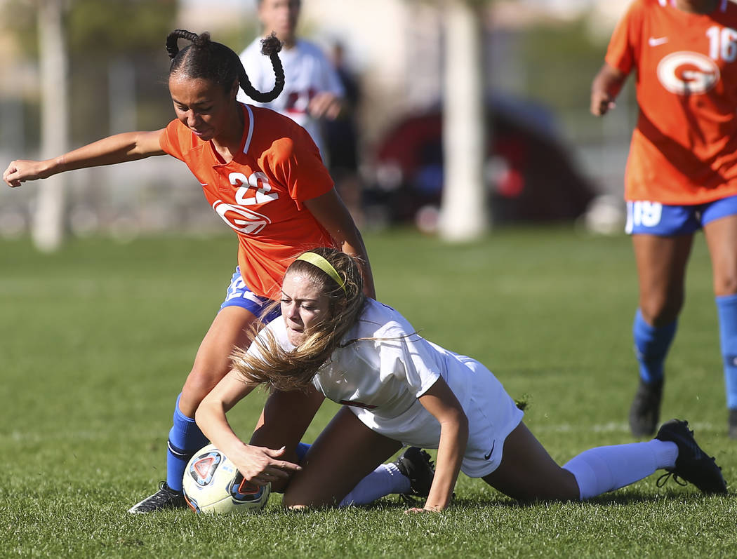 Bishop Gorman’s Kennedy Enus (22) battles for the ball against Coronado’s Alysa ...