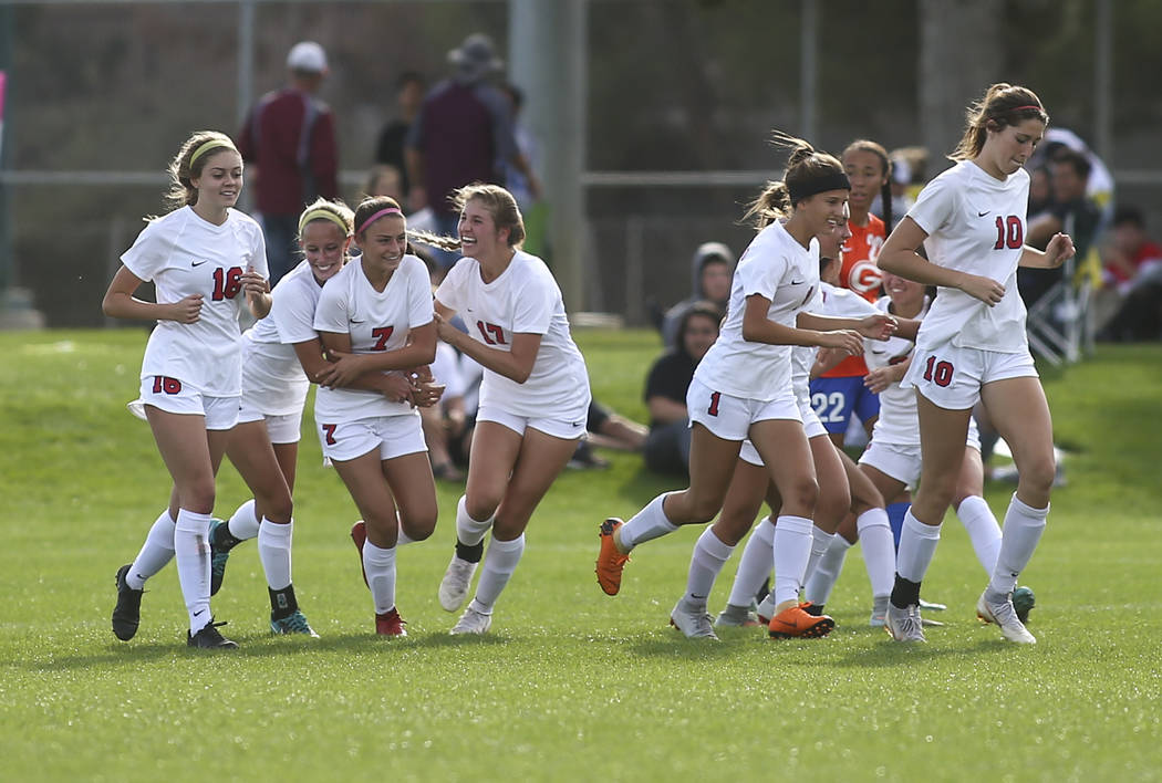 Coronado players celebrate a goal by Coronado’s Alexis Pashales (7) during the Desert ...