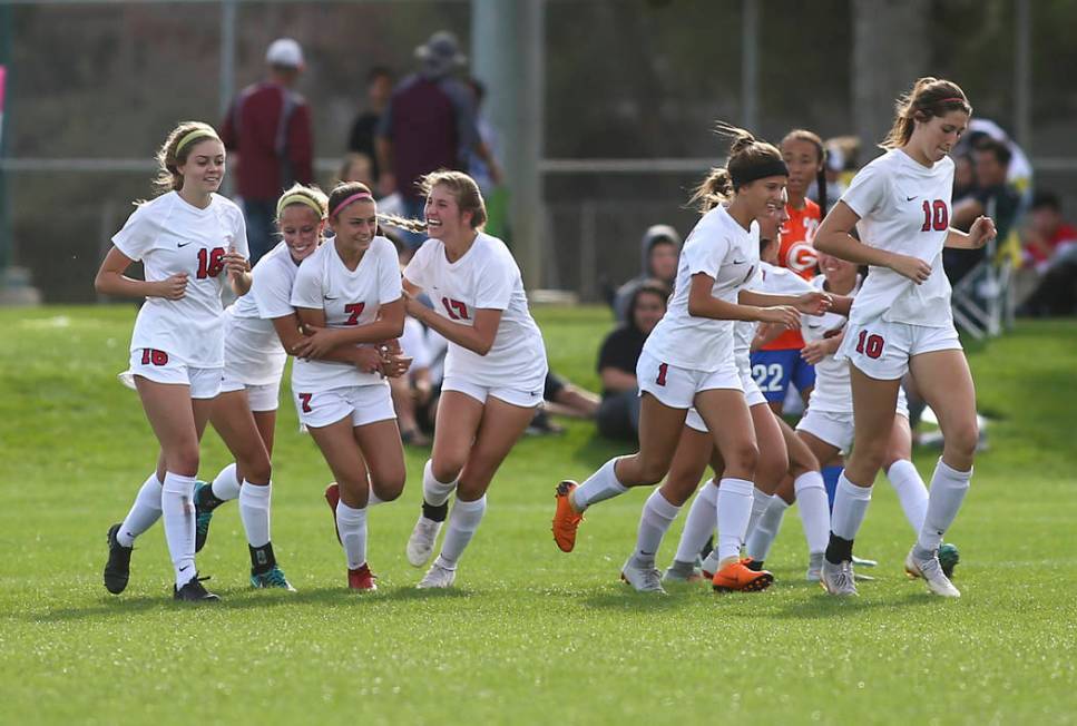 Coronado players celebrate a goal by Coronado’s Alexis Pashales (7) during the Desert ...